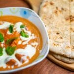 Chicken tikka masala served with naan bread