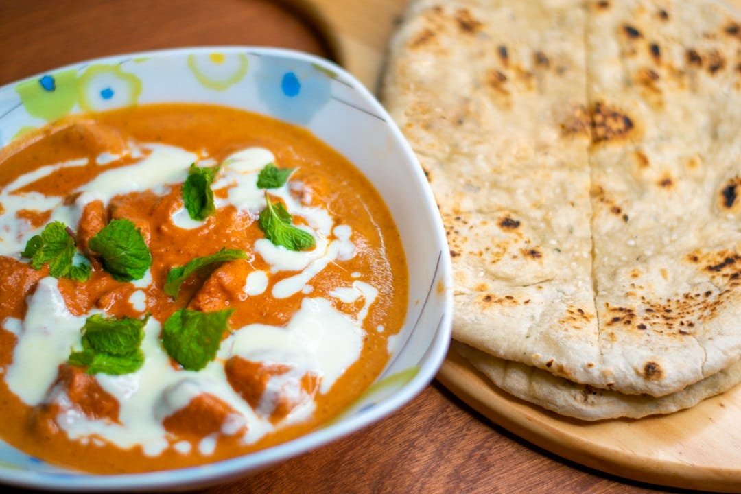 Chicken tikka masala served with naan bread