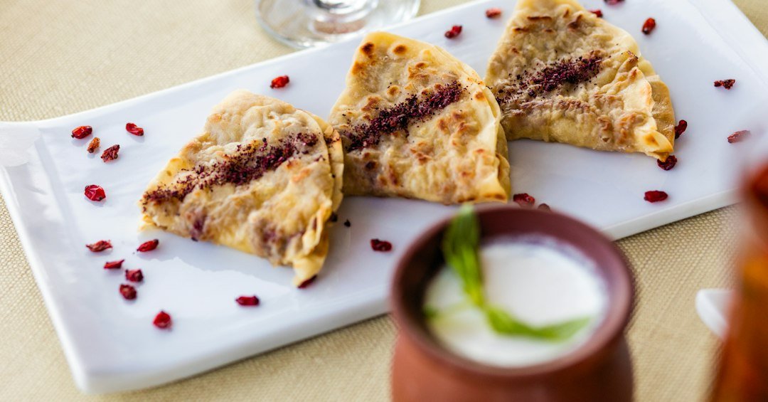 Indian stuffed flatbread served with yogurt