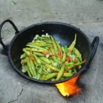 Cooked vegetables in a pan; illustrative stock photo for bendakaya fry recipe