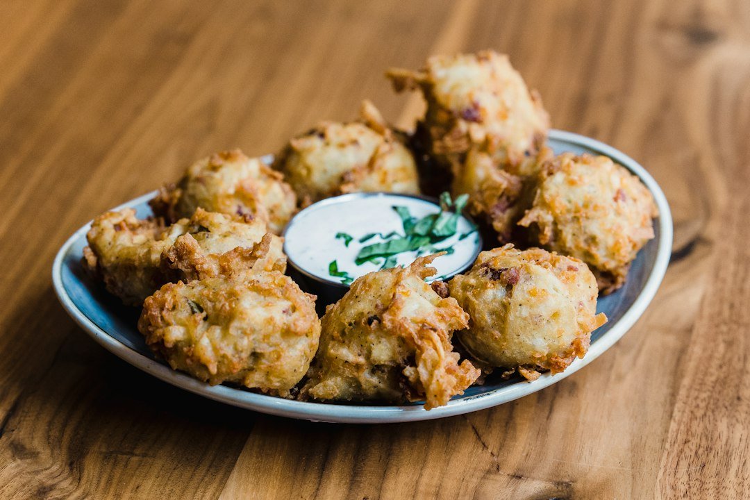 Golden Indian onion pakora fritters served on a plate