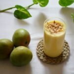 Mango drink in a glass as an illustrative image for mango lassi