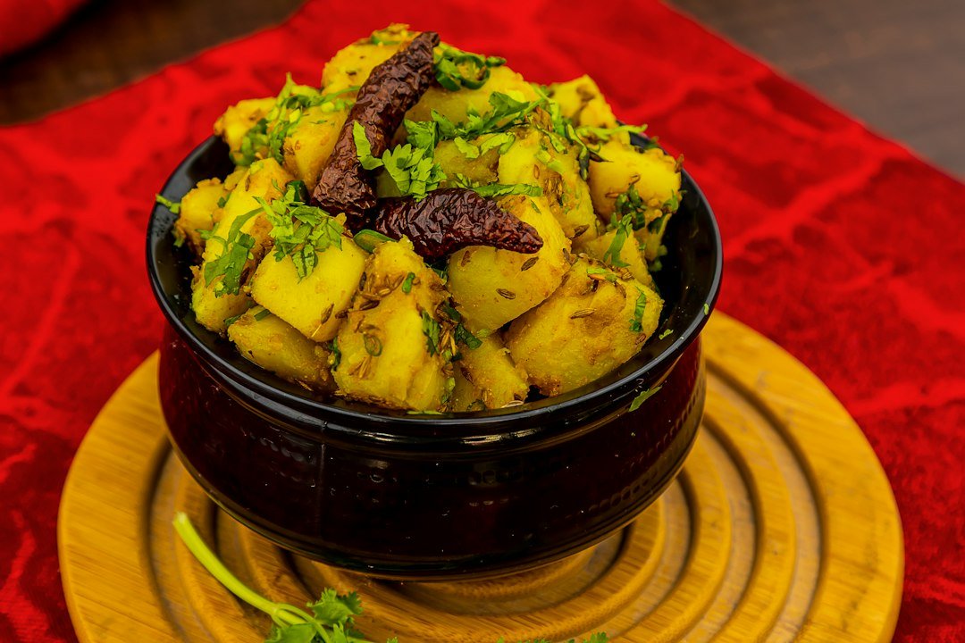 Indian potato curry garnished with coriander